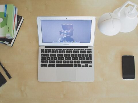 A laptop open on a desk